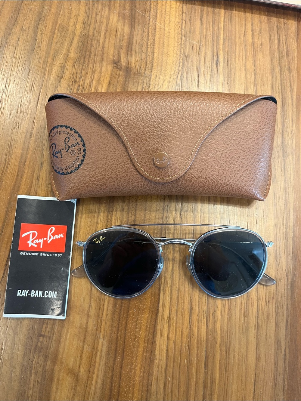 Ray-Ban Round Sunglasses with Clear Blue Frames and Black Lenses